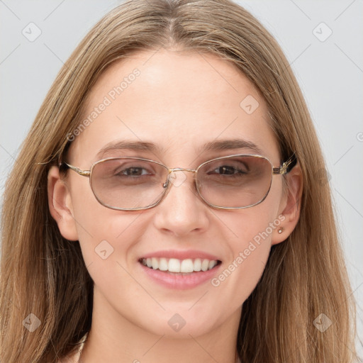 Joyful white young-adult female with long  brown hair and grey eyes