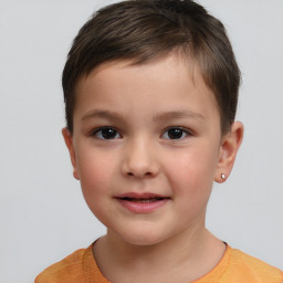 Joyful white child male with short  brown hair and brown eyes