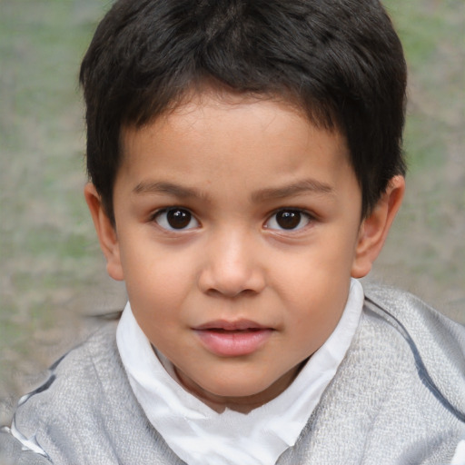 Joyful white child female with short  brown hair and brown eyes