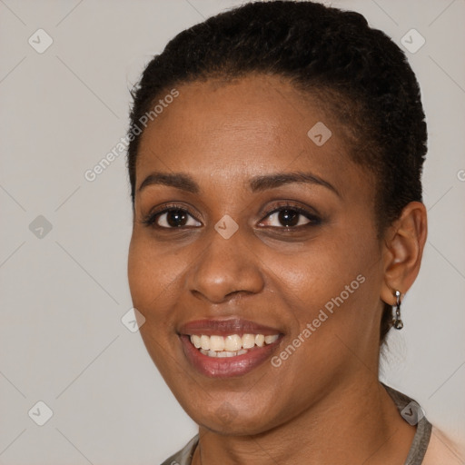 Joyful black young-adult female with short  brown hair and brown eyes