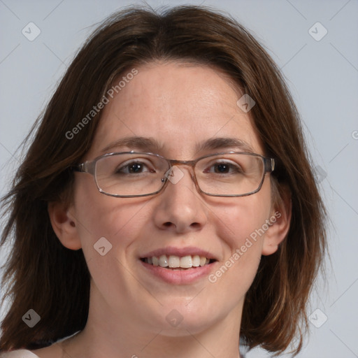 Joyful white adult female with medium  brown hair and grey eyes