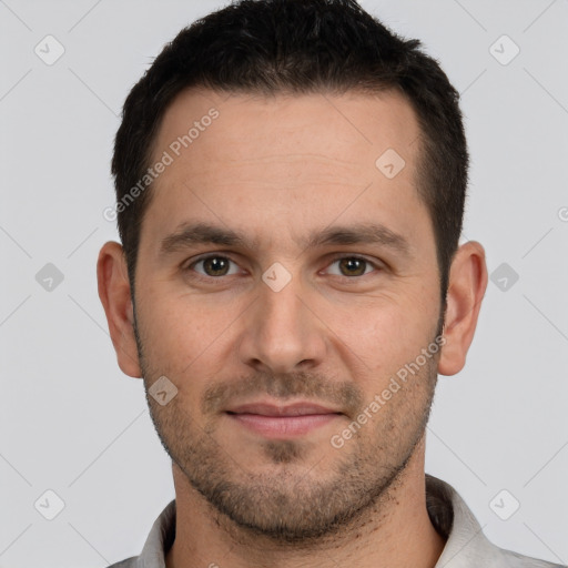 Joyful white young-adult male with short  brown hair and brown eyes