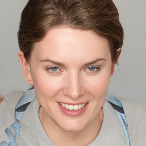 Joyful white young-adult female with medium  brown hair and blue eyes