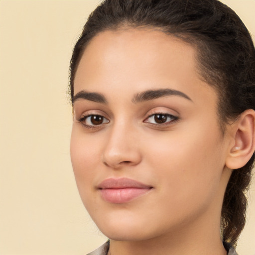 Joyful white young-adult female with long  brown hair and brown eyes