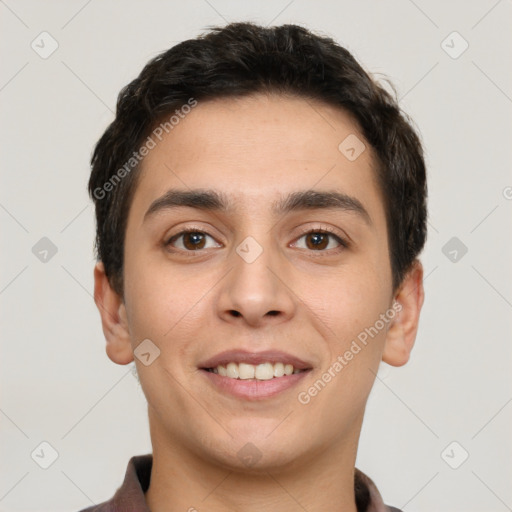 Joyful white young-adult male with short  black hair and brown eyes