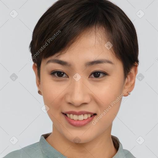 Joyful asian young-adult female with short  brown hair and brown eyes