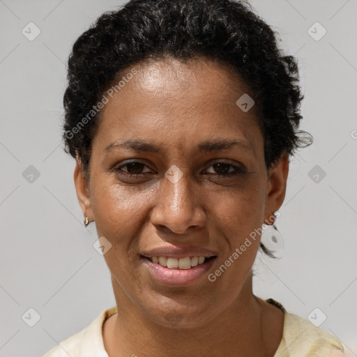 Joyful black adult female with short  brown hair and brown eyes