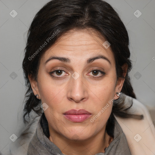 Joyful white adult female with medium  brown hair and brown eyes