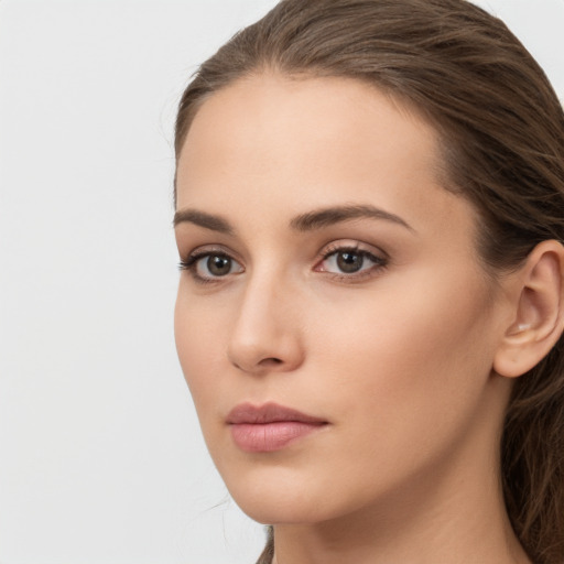 Neutral white young-adult female with long  brown hair and brown eyes