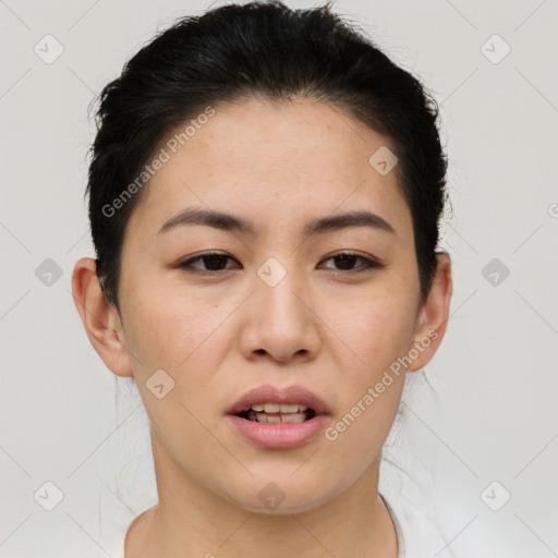 Joyful asian young-adult female with short  brown hair and brown eyes