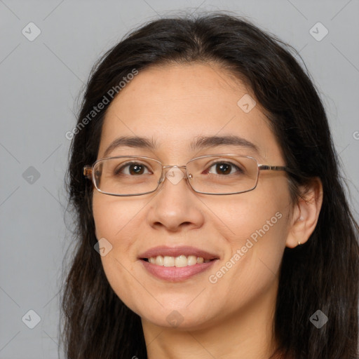 Joyful white adult female with long  brown hair and brown eyes