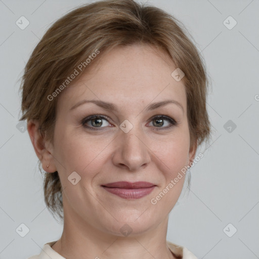 Joyful white adult female with medium  brown hair and grey eyes