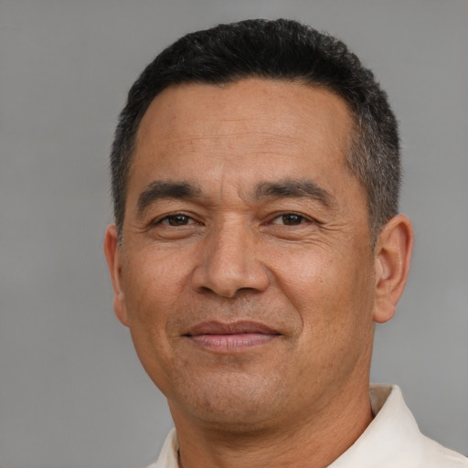 Joyful asian adult male with short  black hair and brown eyes