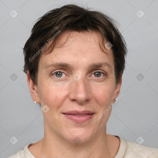 Joyful white adult female with short  brown hair and grey eyes