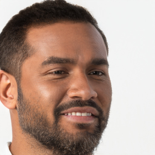 Joyful black young-adult male with short  brown hair and brown eyes