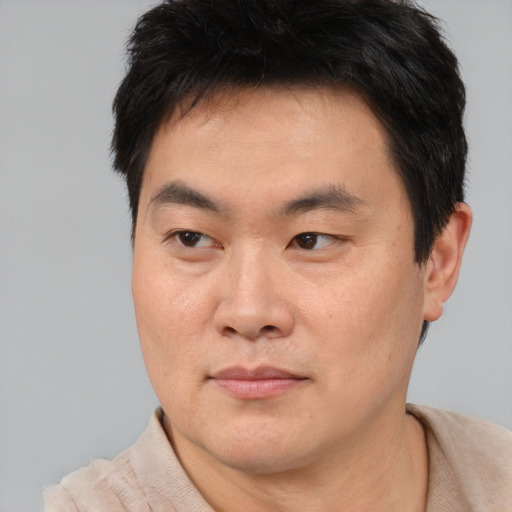 Neutral asian young-adult male with short  brown hair and brown eyes