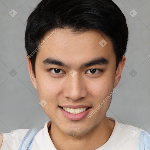 Joyful asian young-adult male with short  brown hair and brown eyes