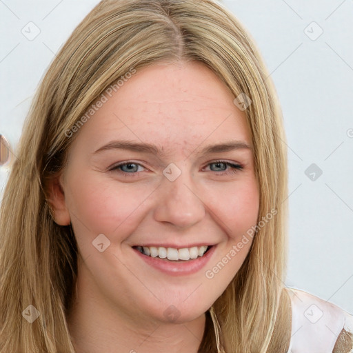 Joyful white young-adult female with long  brown hair and blue eyes