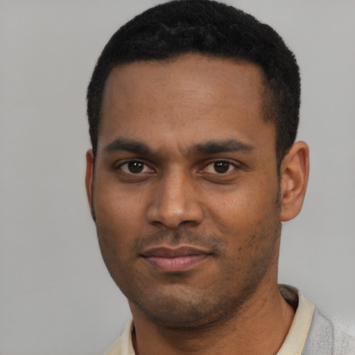 Neutral black young-adult male with short  black hair and brown eyes