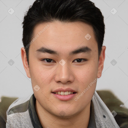 Joyful asian young-adult male with short  brown hair and brown eyes