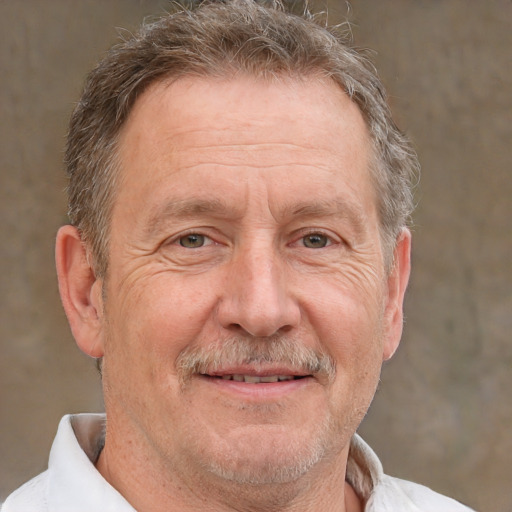 Joyful white middle-aged male with short  brown hair and brown eyes