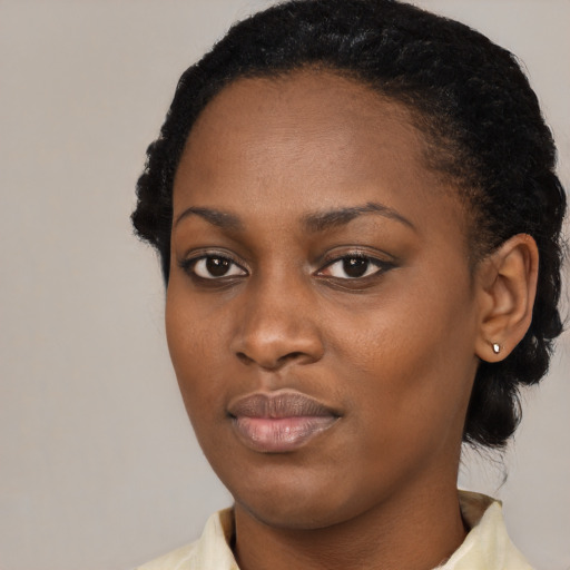Neutral black young-adult female with short  black hair and brown eyes