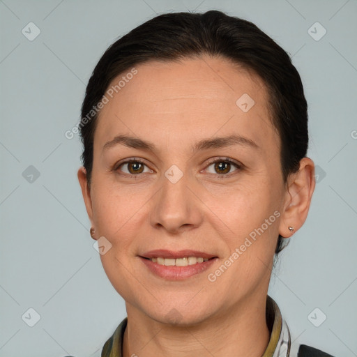 Joyful white adult female with short  brown hair and brown eyes