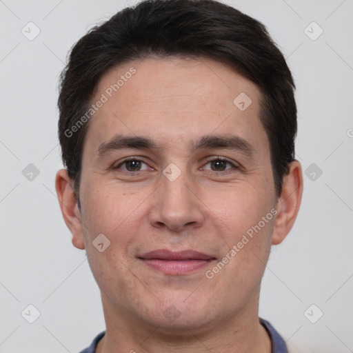 Joyful white adult male with short  brown hair and brown eyes