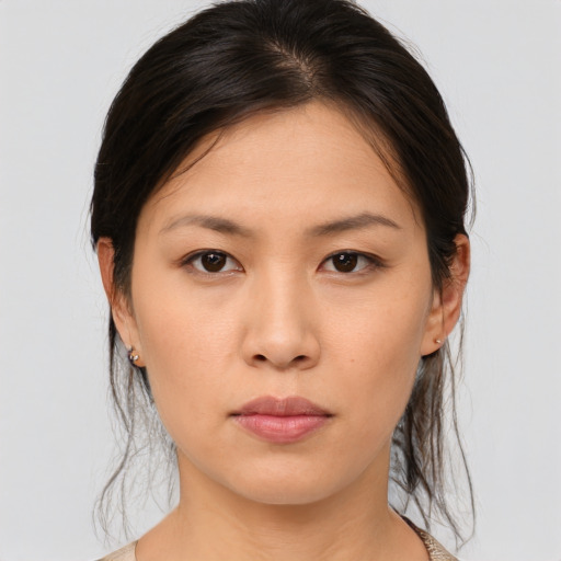 Neutral asian young-adult female with medium  brown hair and brown eyes