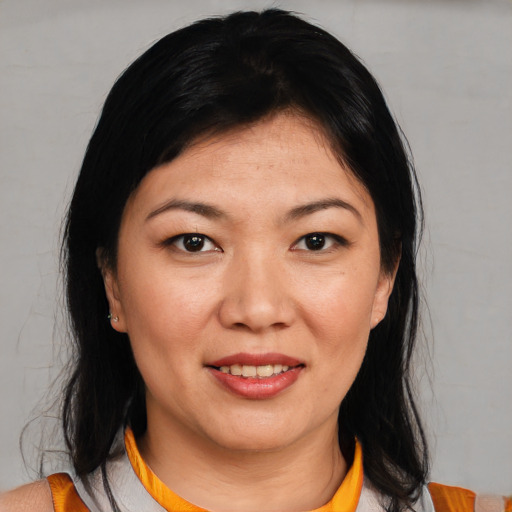 Joyful asian young-adult female with medium  black hair and brown eyes