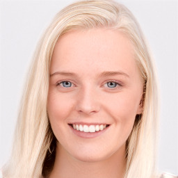 Joyful white young-adult female with long  brown hair and blue eyes