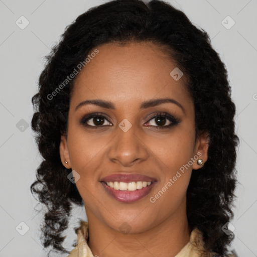 Joyful black young-adult female with long  brown hair and brown eyes