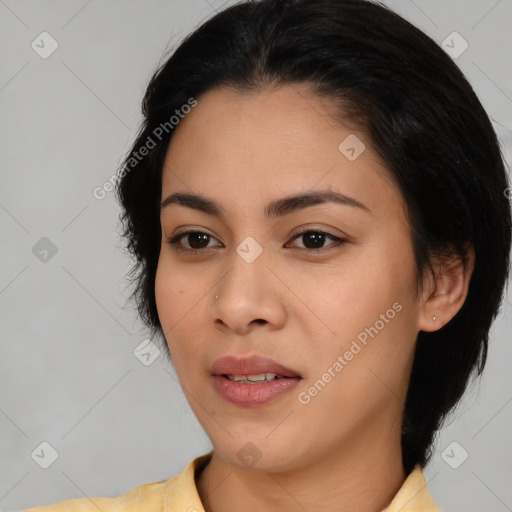 Joyful asian young-adult female with medium  black hair and brown eyes