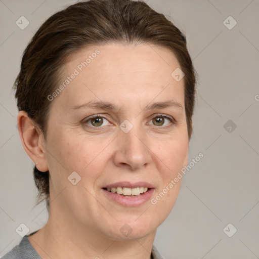 Joyful white adult female with medium  brown hair and grey eyes