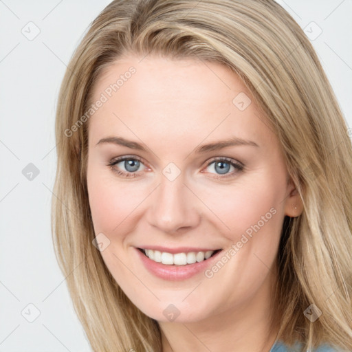 Joyful white young-adult female with long  brown hair and blue eyes