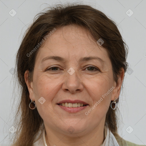 Joyful white adult female with medium  brown hair and brown eyes