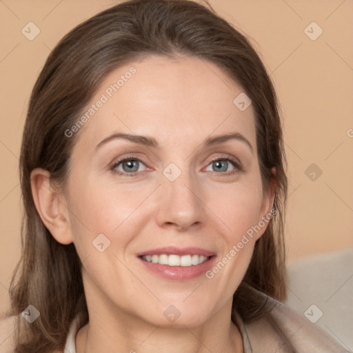 Joyful white adult female with medium  brown hair and grey eyes