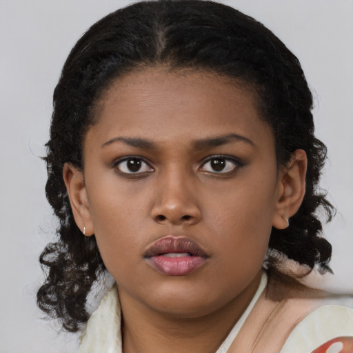 Neutral black young-adult female with medium  brown hair and brown eyes