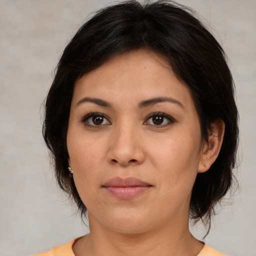 Joyful white young-adult female with medium  brown hair and brown eyes