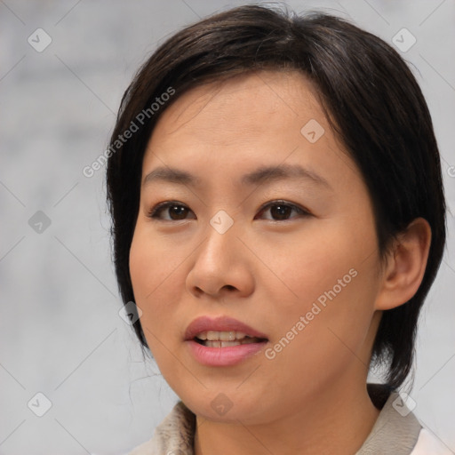 Joyful asian young-adult female with medium  brown hair and brown eyes