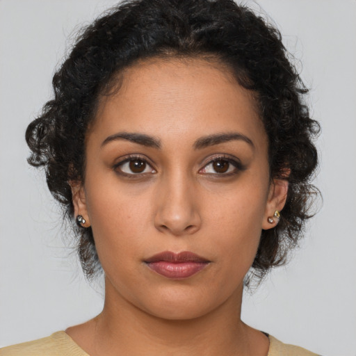 Neutral latino young-adult female with medium  brown hair and brown eyes
