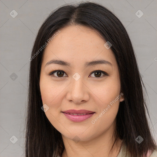 Joyful asian young-adult female with long  brown hair and brown eyes