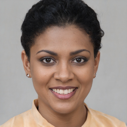 Joyful latino young-adult female with short  brown hair and brown eyes