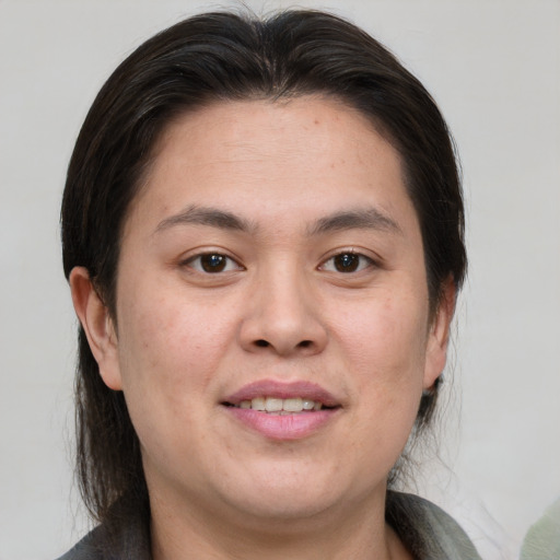 Joyful white young-adult female with medium  brown hair and brown eyes