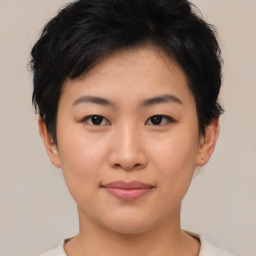 Joyful asian young-adult female with short  brown hair and brown eyes