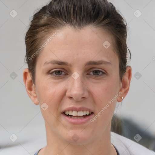 Joyful white adult female with short  brown hair and grey eyes