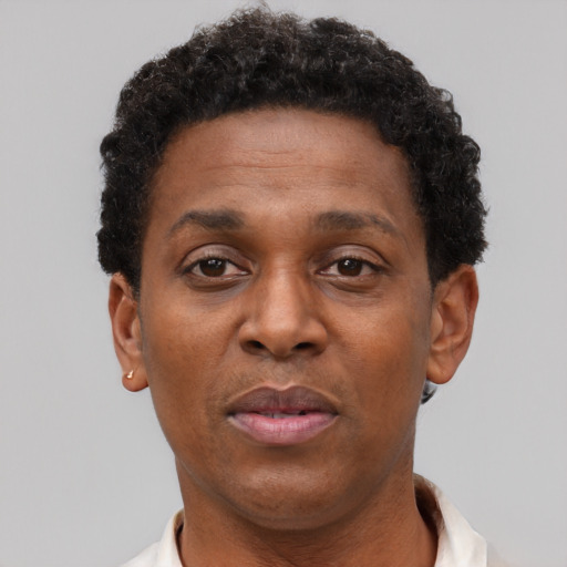 Neutral black adult female with short  brown hair and brown eyes