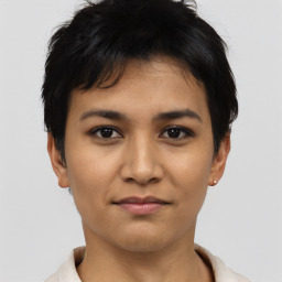 Joyful asian young-adult female with short  black hair and brown eyes