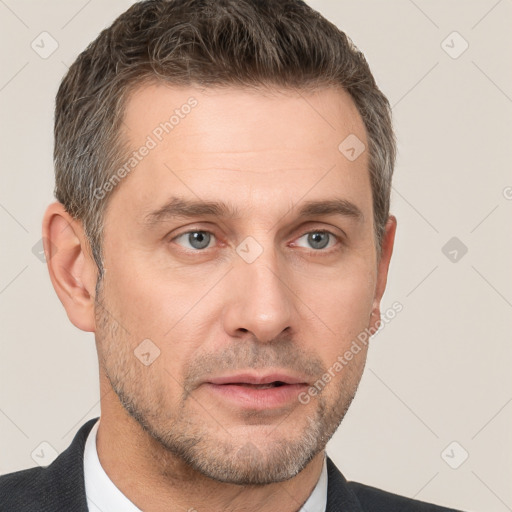 Neutral white adult male with short  brown hair and grey eyes