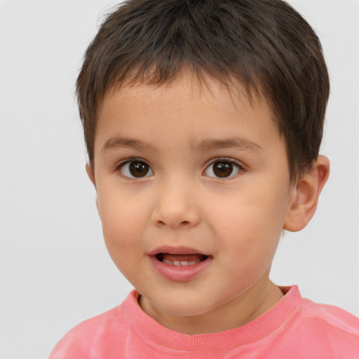 Joyful white child male with short  brown hair and brown eyes